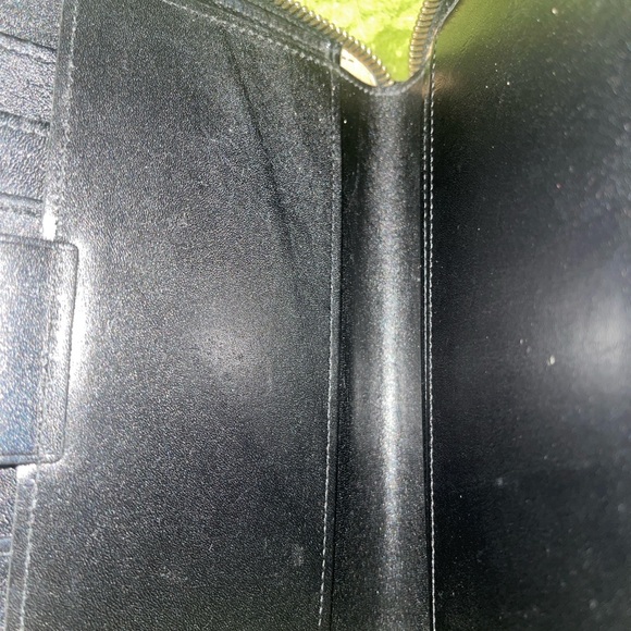 Dooney and Bourke zip along wallet in solid black. - Picture 10 of 12